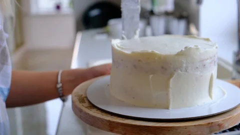 A confectioner prepares a cream cake. Stock Footage 113017622