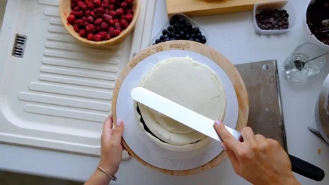 A confectioner prepares a cream cake. Stock Footage 113017965