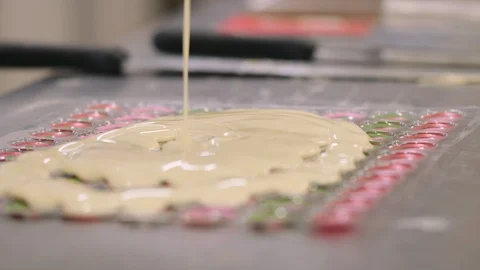 Confectioner preparing chocolates molds Stock Footage 98859046