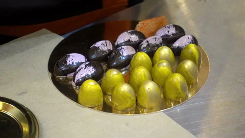 Confectioner puts chocolate candy Stock Footage 99171489