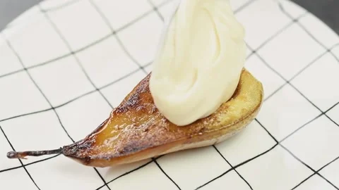 Confectioner puts creme over maple glazed pear. Stock Footage 159805949