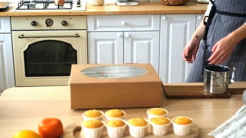 Confectioner puts cupcakes in a box. 動画素材 126601994