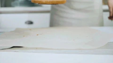 Confectioner puts a piece of cake on the table Stock Footage 68722107