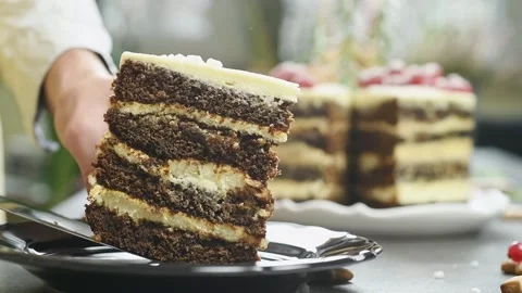 The confectioner serves piece gingerbread layer cake. Stock Footage 171186281