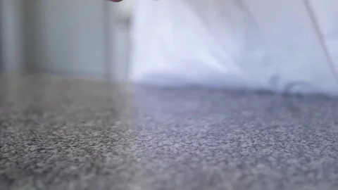 Confectioner spreading flour on the table Stock Footage 78583908