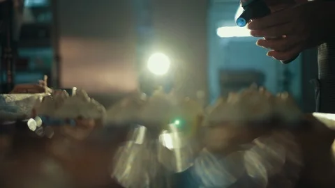 Confectioner is using device to decorate meringue Stock Footage 120626772