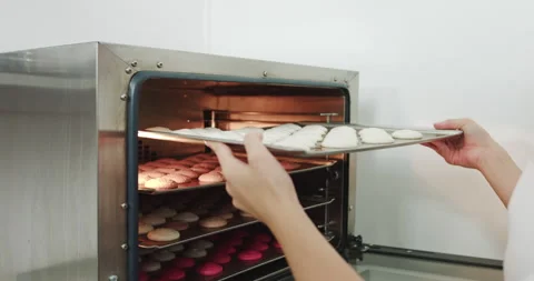 Confectionery Preparation Process. Chef Placing A Colorful Tray Full Of Macarons Stock Footage 150121998