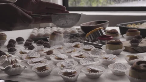 Confectionery work table, hand sifted powdered sugar into sheet alfajores Video stock 240355935
