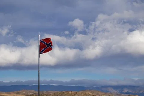 Confederate flag flutters on the wind Stock Photos