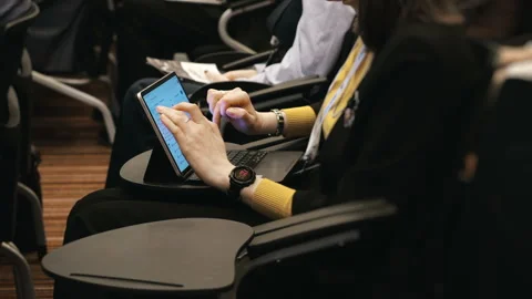 Conference Attendee Using Tablet During Business Event. 스톡 동영상 347776982