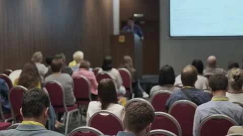 Conference audience listening to speaker presentation in seminar room during Stock Footage 346760940