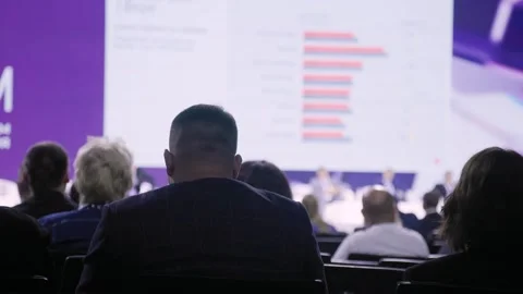 Conference audience watching analytical presentation rows of seated Stock Footage 328904906
