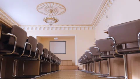 Conference hall for presentations with white screen, tribune, seats Stock Footage 96759102