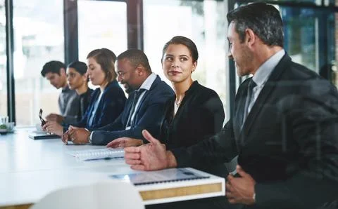 The conference is intriguing conversations between them. a diverse group of Stock Photos