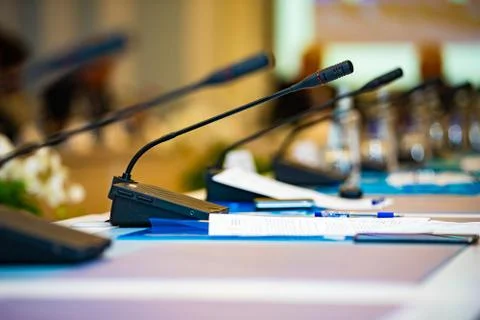 The conference microphones on the table empty Stock Photos