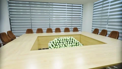 Conference room. Big rectangle table. White flowers in center Stock Footage 162117071