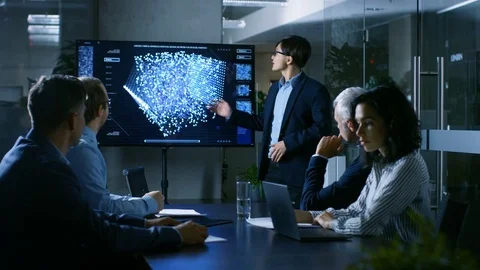 In the Conference Room Chief Engineer Presents to a Board of Scientists Stock Footage 83769434
