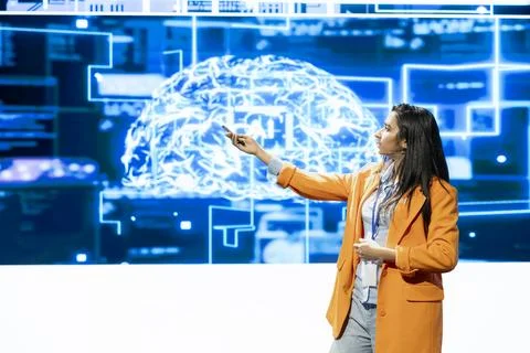 Conference speaker points at neural network digital brain graphic Stock Photos