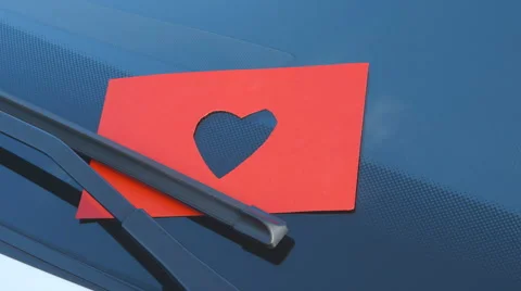 Confessions on a Windshield - Paper Cut - Heart Shape - camera pan Stockbeeldmateriaal 62262761