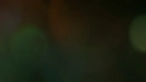 Confetti explosion with color reflections in defocus. Video stock 87400019