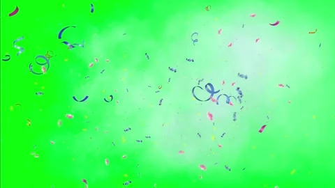 Confetti falling on green background with smoke effects Video stock 338222198