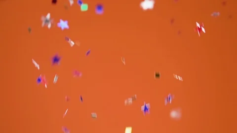 Confetti falls on orange background, slow motion. Stock Footage 120302071