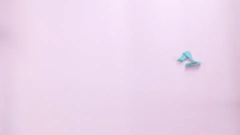 Confetti falls on a pink background. The concept of celebration Video stock 112179709