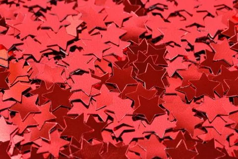Confetti in the form of red stars as background texture Stock Photos