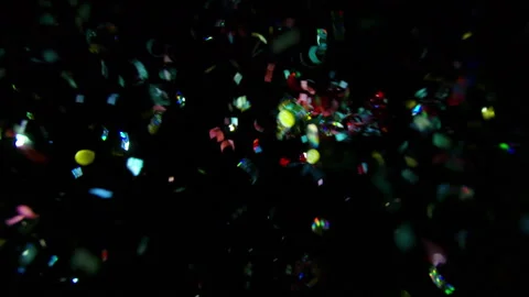 Confetti / Glitter gun popper explosion against black / 3 different shots Stock Footage 196257543