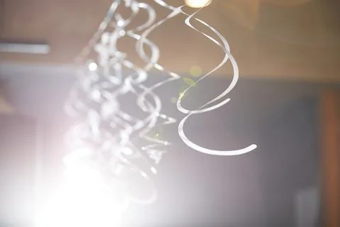Confetti hanging from the ceiling during the celebration of the holiday Stock Photos