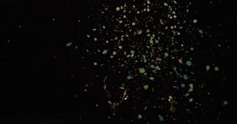 Confetti Isolated on Black, shooting right to left slow motion Stock Footage 74366104