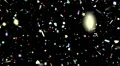 Confetti shapes falling slow motion DOF loop on black HD Footage