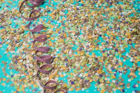 Confetti spread on blue background with text in portuguese Stock Photos