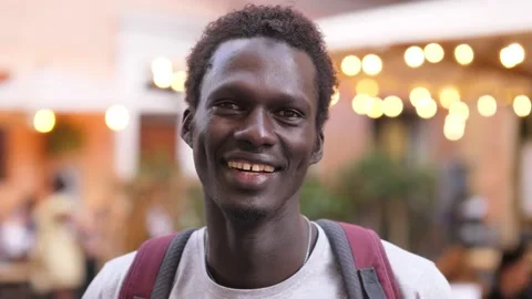 Confidence, joy - relaxed young black man on the street laughs at the camera Stock-Footage 224301281