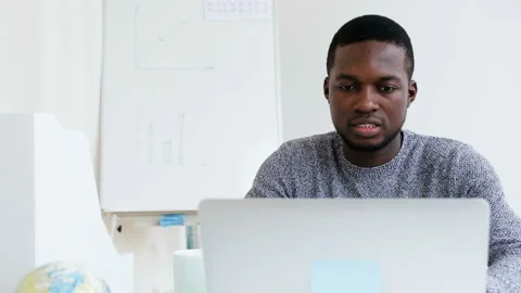 Confident African male computer engineer working on update application using Stock Footage 109156058