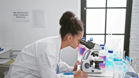 Confident and beautiful young hispanic woman scientist, sporting curly hair.. Stock Footage 263482819