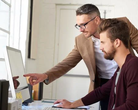 Confident and creative. Portrait of a handsome businessman working in his office Stock Photos