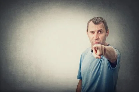 Confident and determined middle age man pointing index finger to camera, like Stock Photos