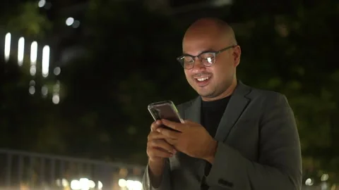 Confident and happy businessman using smartphone to communication of business. Video stock 243251853