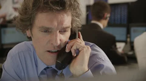 Confident and mature stock market trader doing a deal over the phone Stock Footage