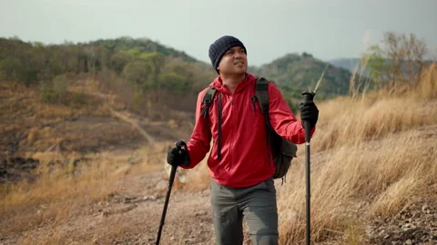 Confident and powerful man challenge for purpose with backpack hiking on rocky. Stock Footage 171790881