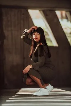 A confident and stylish plus-size woman posing by Stock Photos