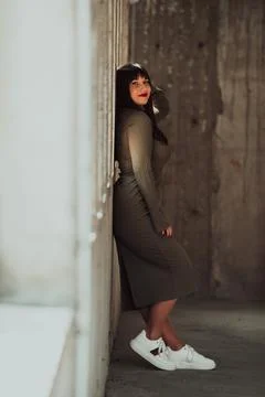 A confident and stylish plus-size woman posing by Stock Photos