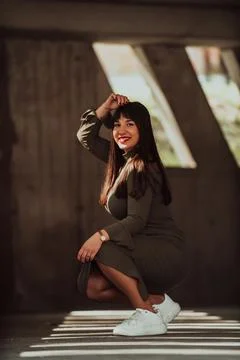 A confident and stylish plus-size woman posing by Stock Photos
