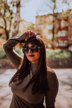 A confident and stylish plus-size woman walking by Stock Photos