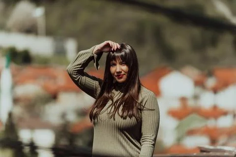 A confident and stylish plus-size woman walking by Stock Photos