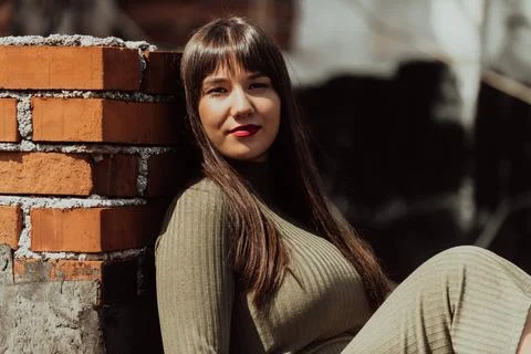 A confident and stylish plus-size woman walking by Stock Photos