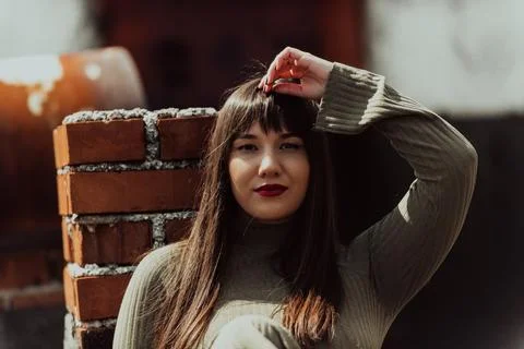 A confident and stylish plus-size woman walking by Stock Photos