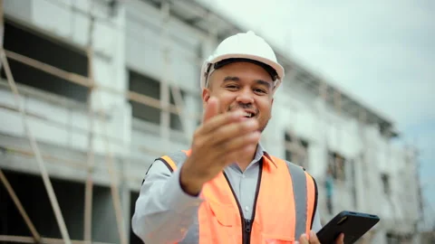 Confident asian engineer man shake hands and standing with tablet to inspection. Stock Footage 194520956