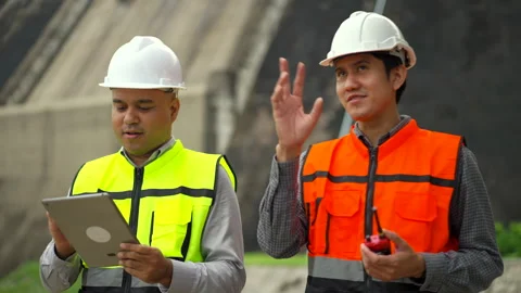 Confident asian two maintenance engineers man inspection with in tablet. Stock Footage 247120097